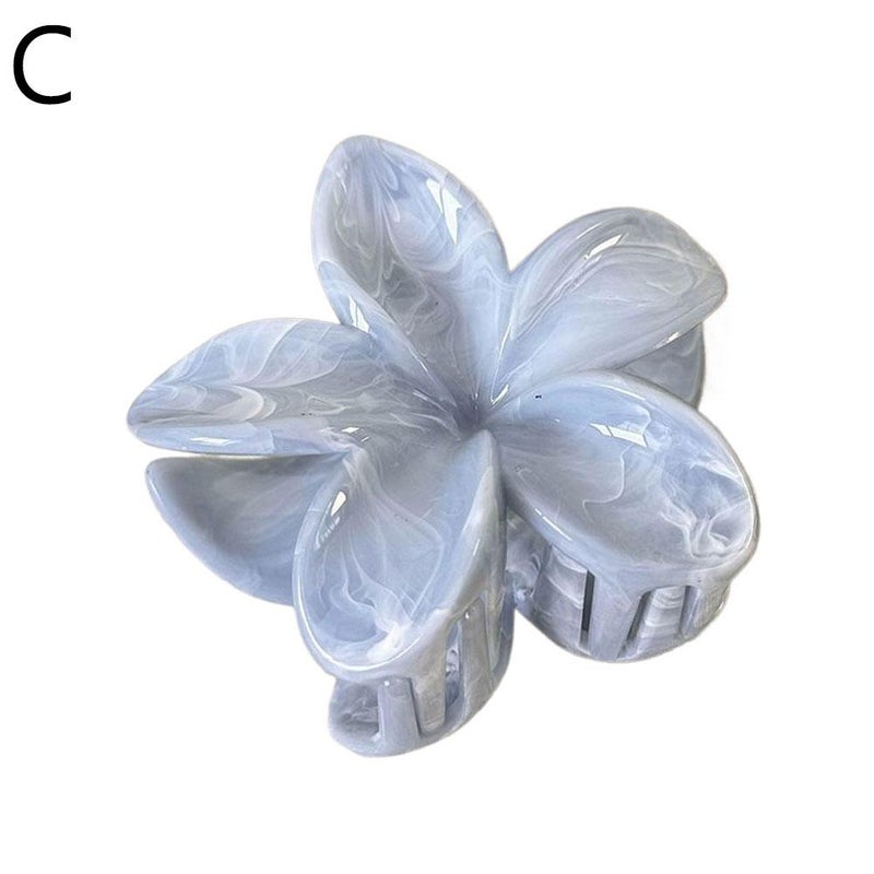 Summer mint, mambo, frangipani, and gradient floral hair clips create a sophisticated look. Sweet, 3D hair clips at the back of the head.